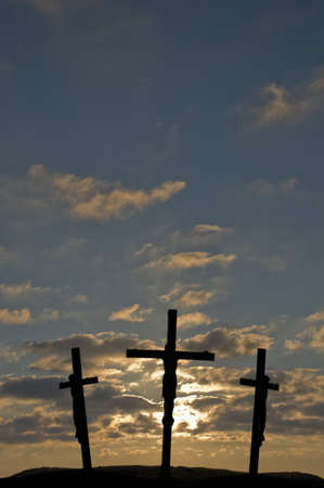 Jesus on the Cross with sunset in the backgroundの写真素材