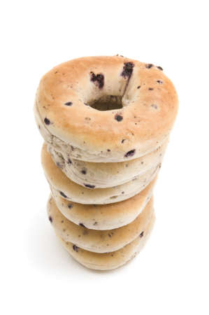 Stack of blueberry bagels on white backgroundの写真素材