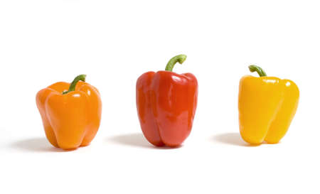 Orange, red and yellow peppers isolated on a white background.の写真素材