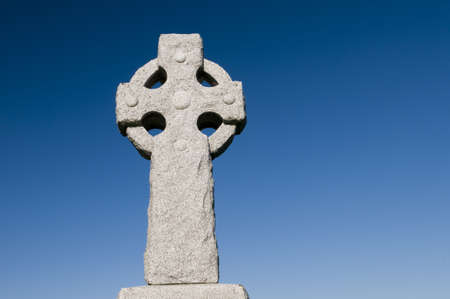 Celtic Cross on deep blue sky created with polarizing filter, with lots of copy spaceの写真素材