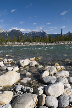 Boulders in the foreground of the Snaring River in Jasper National Parkの写真素材