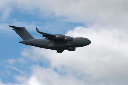 Flying next to a large military transport plane