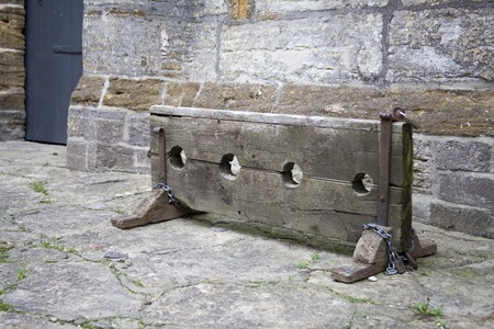 Wooden stocks - traditional punishment for crime in English villageの写真素材