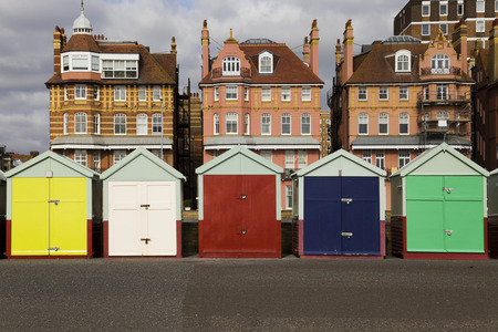 Five multi coloured beach huts on sea front at Brighton, Englandのeditorial素材
