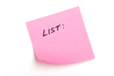 Pink post it note isolated on white with word "list:" written.の写真素材