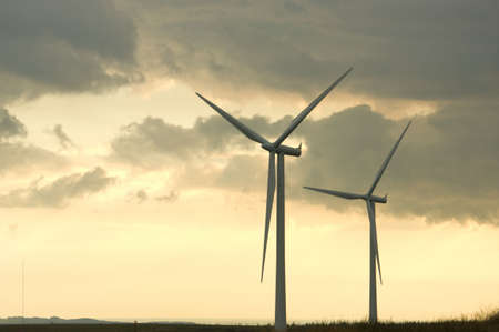Turbines on a wind farm at sunset in Scottish summer