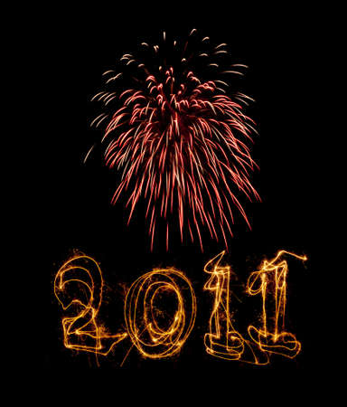 Year 2011 written in sparklers below pink fireworks. Use for celebrations like New Years, 4th July,...