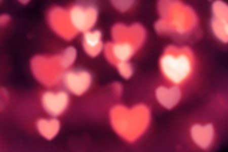 Heart-shaped lights out of focus. Abstract pattern background in pink tonesの写真素材
