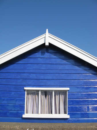 Blue beach hut on sunny day in Southwold, Suffolk, England, UKの写真素材