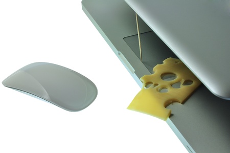 laptop with cheese like mousetrap and mouse.の写真素材