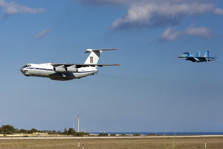 Luqa, Malta - 22 September 2016: Ukrainian Air Force Ilyushin Il-76MD [78820] performing a low pass over runway 31 with 2 Ukrainian Su-27 Flankers. Attending the airshow in the coming weekend.のeditorial素材