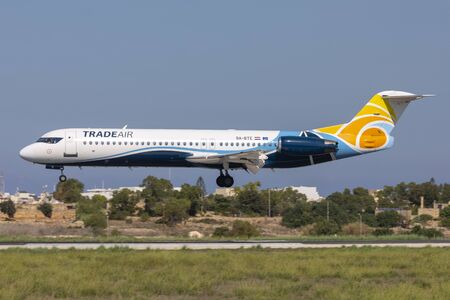 Luqa, Malta - September 29, 2019: Trade Air Fokker 100 (F-28-0100) (REG: 9A-BTE) landing runway 31.