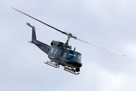 Luqa, Malta September 26, 2014: Italian Air Force Agusta AB-212AM based in Malta for a few years leaving the airfield after performing a rescue demonstration.のeditorial素材
