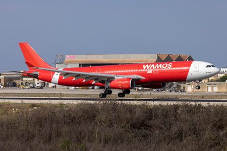 Luqa, Malta - September 7, 2022: Wamos Air Airbus A330-343 (REG: EC-NTY) with partial Air Asia X livery, arriving runway 13, all the way from Abuja, Nigeria.のeditorial素材