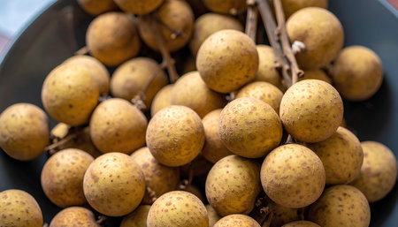 Longan fruits in the market. Fresh longan fruit background.の素材
