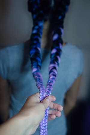 close-up two braids braided on light hair, with kanekalonの写真素材