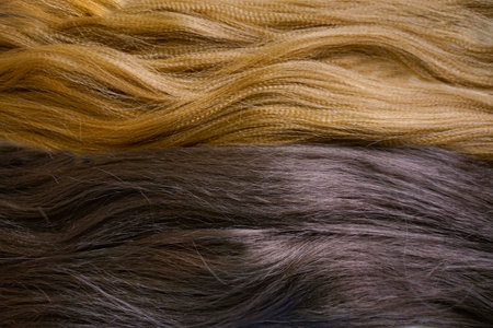 Artificial material for weaving African braids, colored kanekalon lies on the table, different materials for afro braidsの写真素材