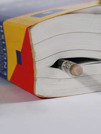 close-up of closed book and pencilの写真素材