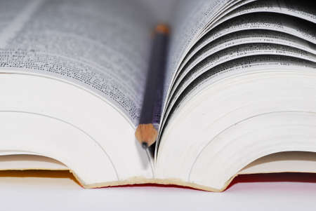 macro photo of book and pencilの写真素材