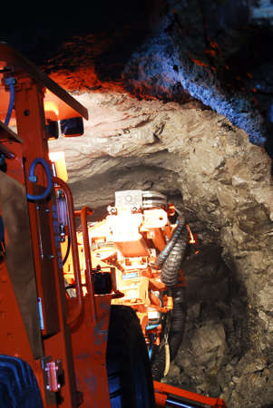heavy duty mine machine working in the shaftの写真素材