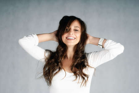 Beautiful young woman happy in relaxing expressionの写真素材