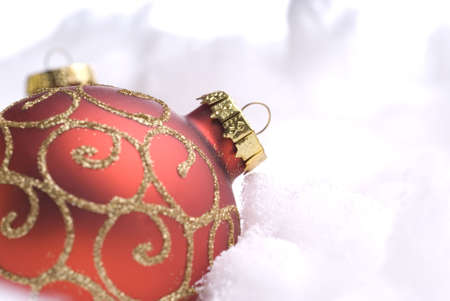 Red Christmas balls on snowの写真素材