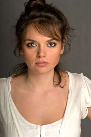 Beautiful young woman portrait over greyの写真素材