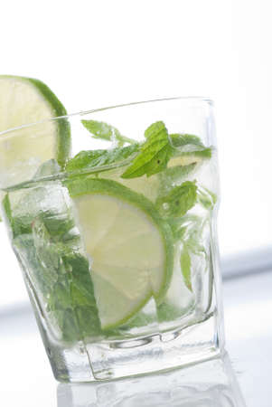 Mojito glass against white background with cold green colorsの写真素材