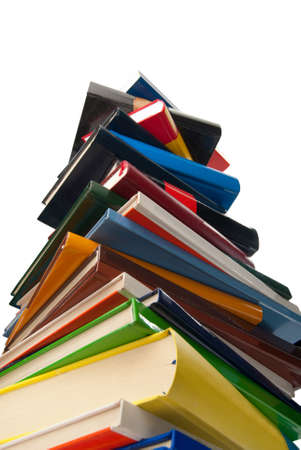 Books towering one over the other isolated on whiteの写真素材