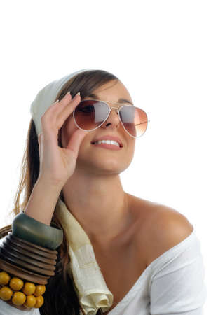 Closeup of a beautiful happy girl with sunglasses isolated on white with copy spaceの写真素材
