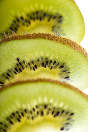 Slices of kiwi closeup side lighting focus controlの写真素材