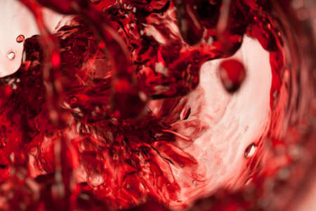 Abstract red wine shot whirlpool and splashingの写真素材