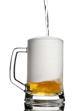 Contrast keg pouring with beer isolated on whiteの写真素材