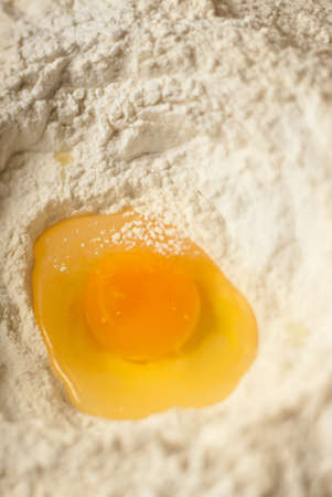 Macro shot of an egg flour volcanoの写真素材
