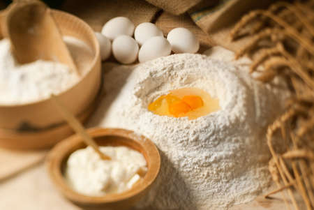 Defocused table full of ingredients with side lightの写真素材