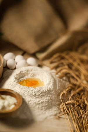 Focus play with an egg volcano on a wooden tableの写真素材