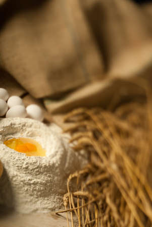 Wheat and wholegrain flour defocused with eggsの写真素材