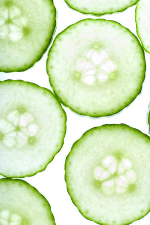 Bright cucumber circles green on white closeupの写真素材