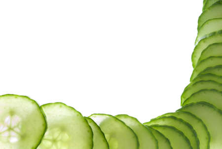 A cucumber slices frame macro on whiteの写真素材