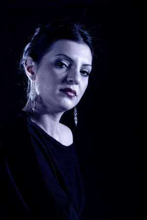 Witch effect on a young adult girl in blackの写真素材