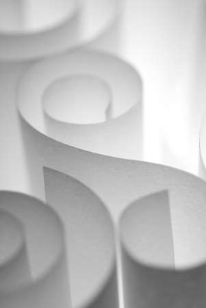 Textured white paper curls under soft lightの写真素材