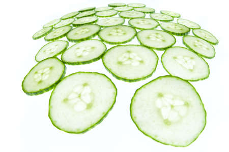 Bright fisheye cucumber shot closeup isolated on whiteの写真素材