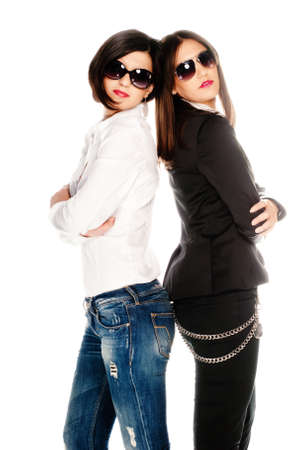 Dressed up girls posing in studio isolatedの写真素材