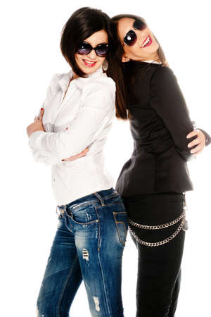Dressed up girls posing in studio isolated on whiteの写真素材