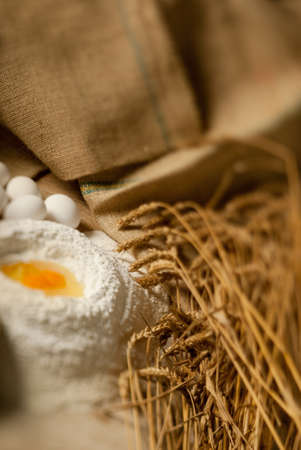 Eggs, wheat and flour on a baking table with a tilt shift lensの写真素材
