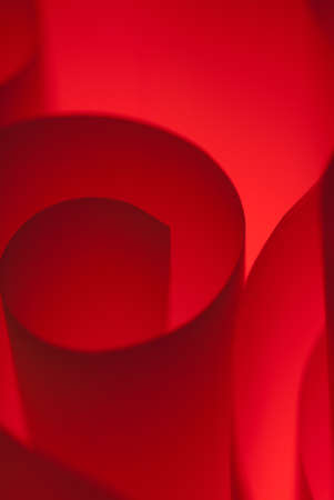 Hard edged spiral made of red paper macroの写真素材
