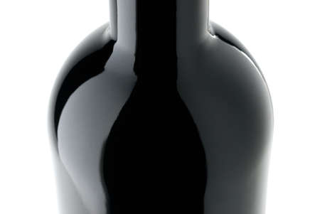 Black wine bottle closeup isolated on whiteの写真素材