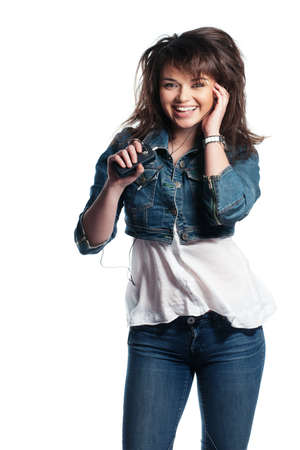 Brunette with big hair in denim on whiteの写真素材