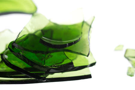 Pile of broken glass in green isolated on whiteの写真素材