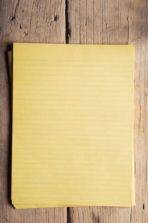 Blank notepaper on raw unpainted hardwood sidelightの写真素材